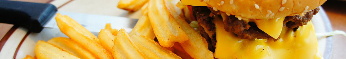 Eating American (Traditional) Burger Fast Food at Carroll's Giant Burger restaurant in Navasota, TX.